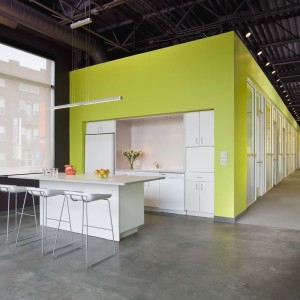 Modern office space with colorful walls and kitchen area
