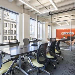 Conference room with large windows and view out to reception desk