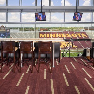 View to field below from suite of Huntington Bank football stadium showing chairs at counter